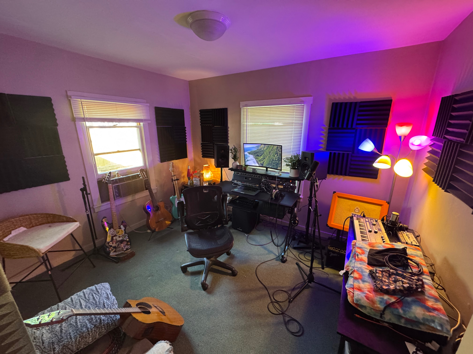 Serpolla home studio with synths, guitars, and acoustic treatment